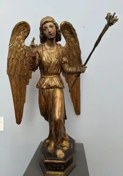 Angel from an Annunciation, poplar wood sculpture, crosses and angels, located in Bode Museum